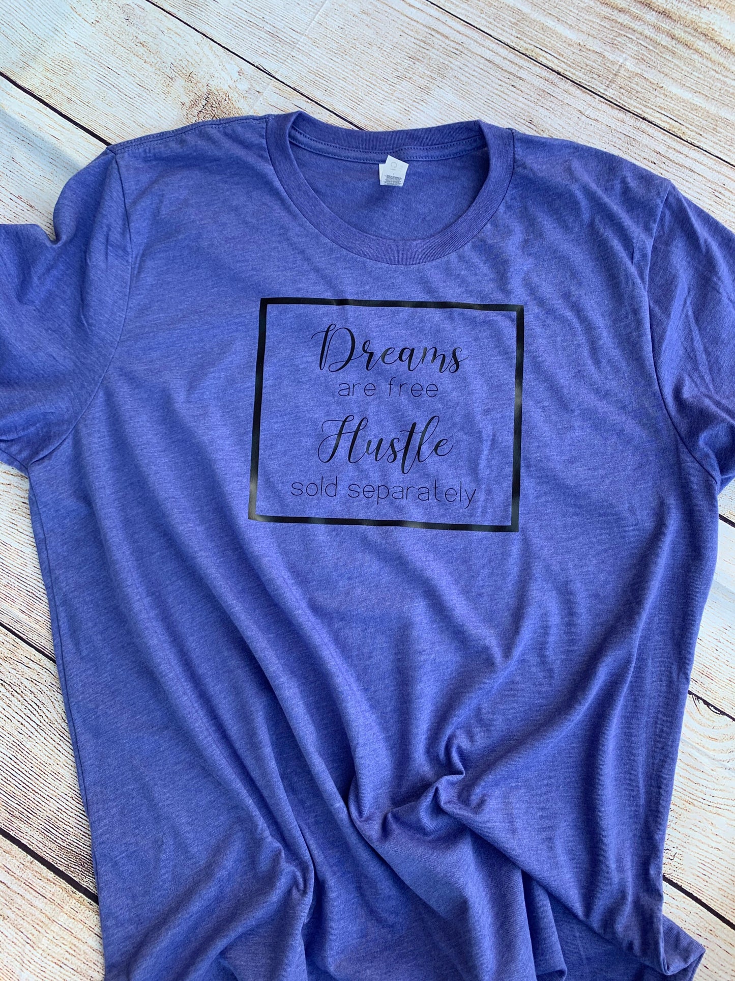 Dreams are free Hustle sold separately T-shirt.