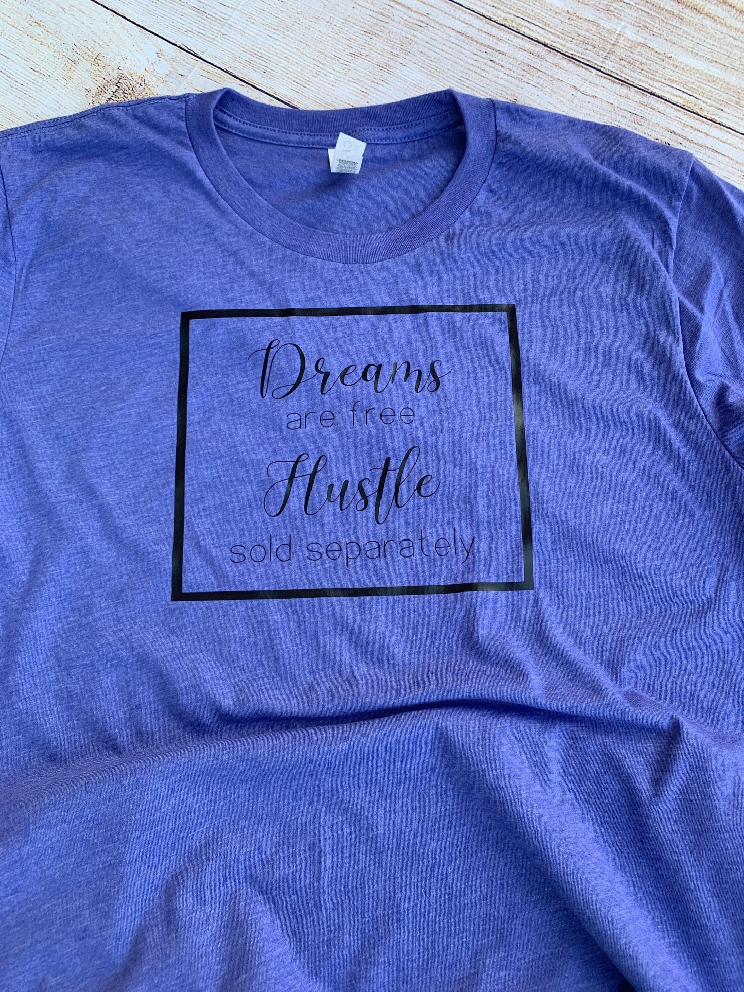Dreams are free Hustle sold separately T-shirt.